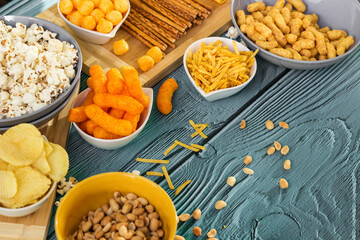 Beer salty snacks on wooden table
