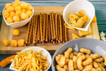 Beer salty snacks on wooden table