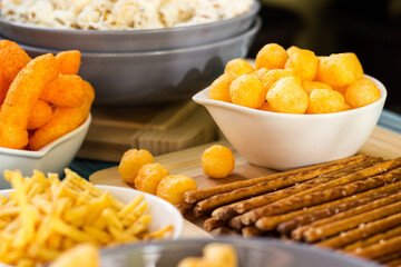 Beer salty snacks on wooden table