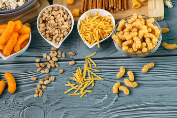 Beer salty snacks on wooden table