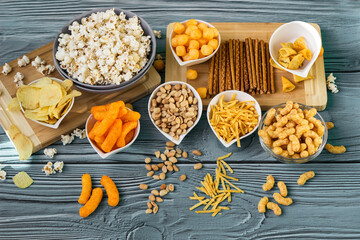 Beer salty snacks on wooden table