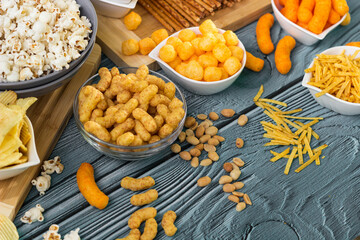 Beer salty snacks on wooden table
