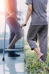 young asian physical therapist working with senior woman on walking with a walker