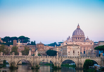 Fototapeta na wymiar Sunset on Tiber river bridge with Vatican City - Rome, Italy