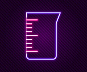 Glowing neon line Laboratory glassware or beaker icon isolated on black background. Colorful outline concept. Vector
