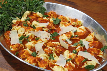 Beef ravioli in tomato sauce and Pecorino cheese