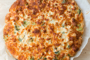 Delicious fresh pie with broccoli, tuna, cheese, spices and herbs