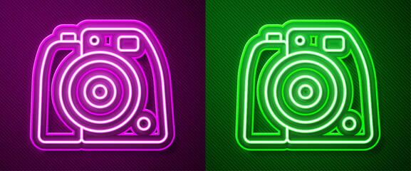 Glowing neon line Photo camera icon isolated on purple and green background. Foto camera. Digital photography. Vector