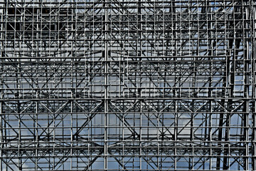 Steel beam abstract. Bare beams of hanger form intricate pattern 