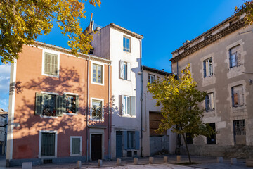Fototapeta na wymiar Nimes in France, old facades in the historic center, typical houses 