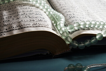 prayer beads and holy koran