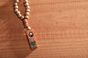 prayer beads against brown background