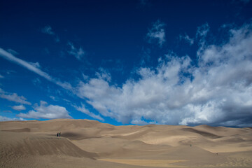 Fototapeta na wymiar Amazing view to the Great Sand Dunes.. Dunes ant clouds in the sky. Very colorful landscape