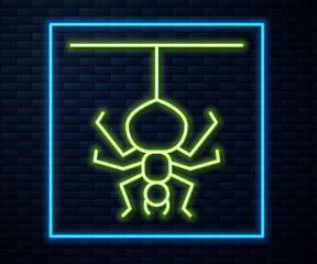 Glowing neon line Spider icon isolated on brick wall background. Happy Halloween party. Vector