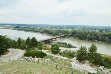 A swift mountain river. Water flows in nature. Mountainous terrain.