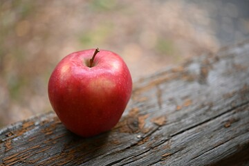 red apple on a wooden surface. the concept of healthy food, diet