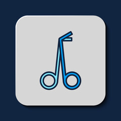 Filled outline Medical scissors icon isolated on blue background. Vector