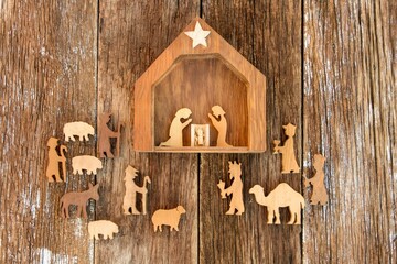 Nativity scene on rustic wooden background