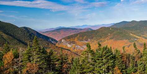 Aerial panorama of Smugglers Notch looking towards the north and away from Stowe in fall colors taken from mountain top