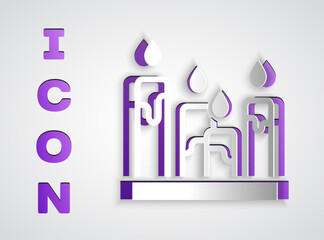 Paper cut Burning candle icon isolated on grey background. Cylindrical aromatic candle stick with burning flame. Happy Halloween party. Paper art style. Vector