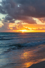 Fototapeta na wymiar Sunrise at Bavaro beach, Dominican Republic. Vertical landscape
