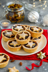 Traditional British fruit mince pies on a plate. Christmas dessert. Selective focus
