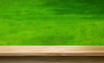 empty wooden table against the blurred nature background, product display stand, 3d mockup