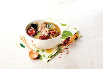 Fototapeta premium Winter Melon and Lotus Fragrant Red Barley and Snails and Pork Tendon Soup served in a bowl isolated on napkin side view of hong kong food