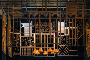 The abstract yellow metal constructions with black background on the theater stage