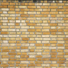 Old rough bare brick wall texture with sand coloured bricks