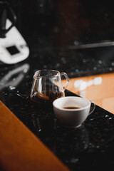 server and cup of coffee in a kitchen counter
