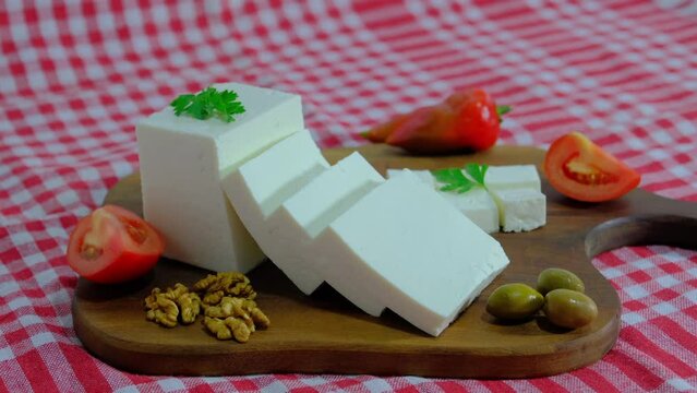 Cheese platter, Cubes of cheese, get cheese from plate. 4K UHD Video
