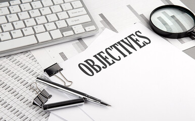 OBJECTIVES text on paper with chart and keyboard, business concept