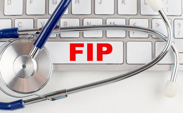 FIP text on keyboard with stethoscope , medical concept