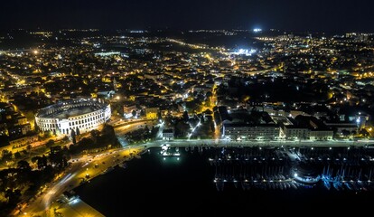 Aerial shot of the beautiful city Pula at night in Croatia
