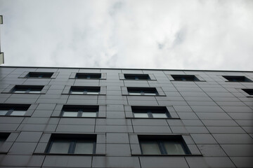 Building in city. House with windows. Architecture in detail.