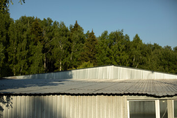 Steel profile building. Roof of production hall. Warehouse building outside.
