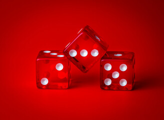three red dice with white dots on a red background