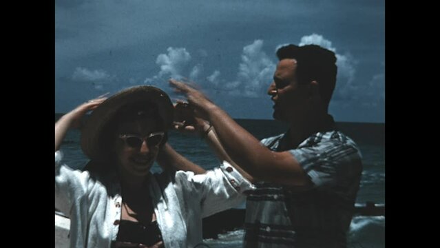 Standing Near the Ocean 1960 - A couple stands near a seawall in Miami, Florida in 1960.