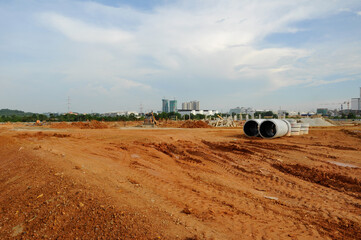 Naklejka premium PERAK, MALAYSIA -APRIL 05, 2016: Earthworks at the construction site to get the necessary level platform. It is carried out before construction starts.