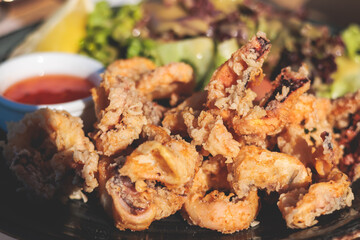Deep fried squid fried calamari rings, grilled kalamaria tiganita, traditional Mediterranean food served in tavern, Corfu, Greek islands, Ionian sea, Greece
