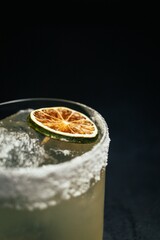 Vertical shot of a tokky's margarita with salt rim