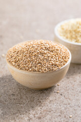 Set with different sesame seeds on stone background. top view.