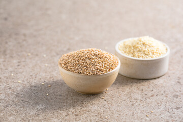 Set with different sesame seeds on stone background. top view.