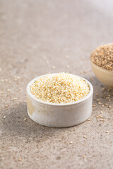 Set with different sesame seeds on stone background. top view.