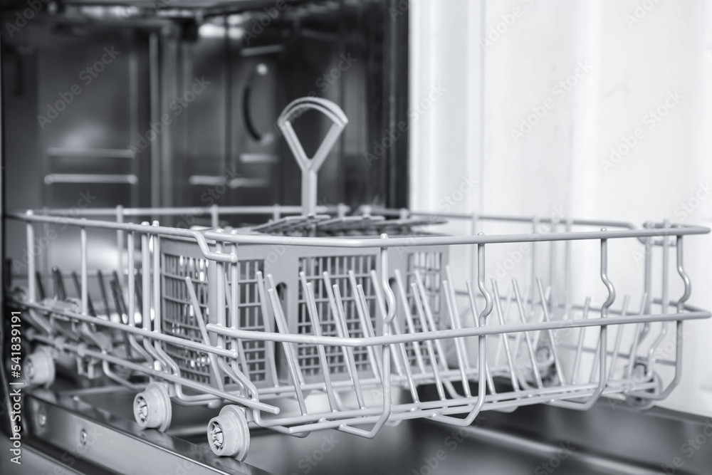 Canvas Prints Open clean empty dishwasher in kitchen, closeup