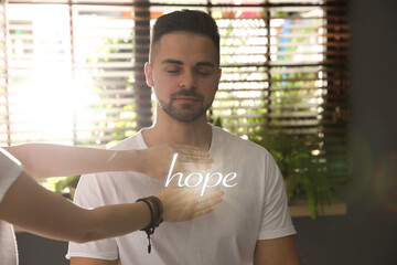 Concept of hope. Young man during healing session