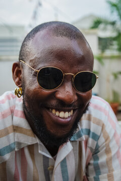 black man in sunglasses smiling
