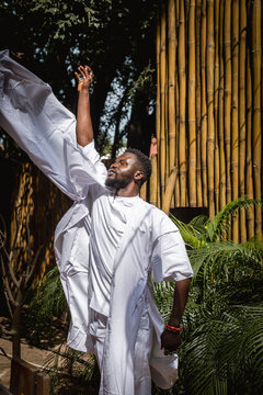 a man dancing in a garden