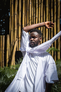 a man dancing in a garden 